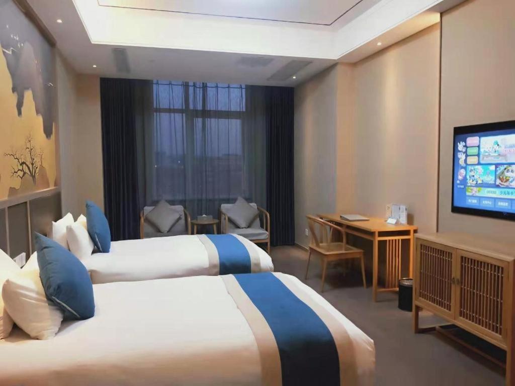 Feicheng Blossom Hotel Extérieur photo